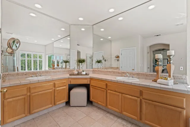 a large kitchen with lots of counter space sink and appliances