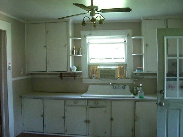 3346 Millerfield Road Macon, GA 31211 - Photo 2 of 6 a bathroom with a sink and a mirror