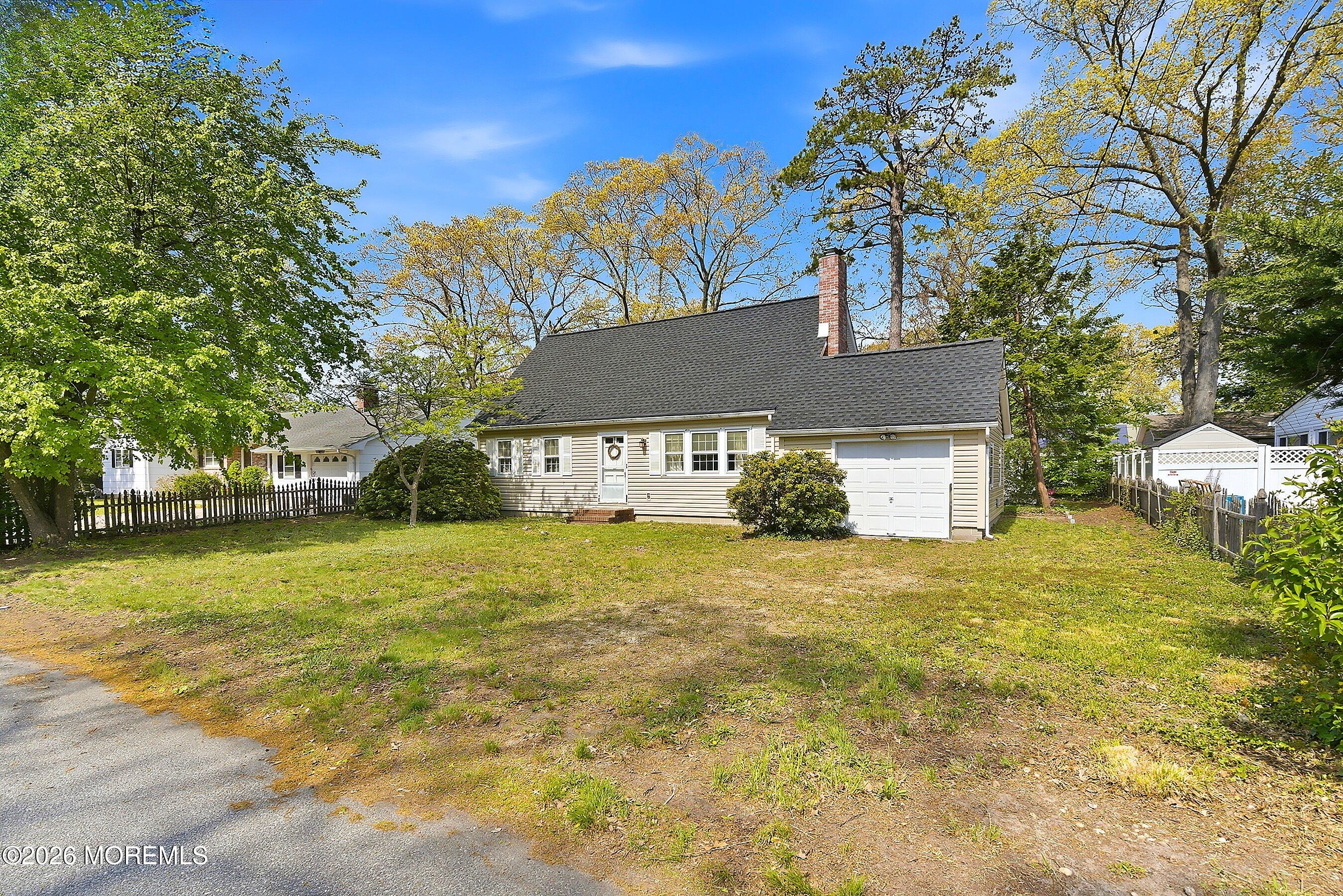 464 Newport Road Forked River, NJ 08731 - Photo 1 of 23 a front view of a house with a yard and trees