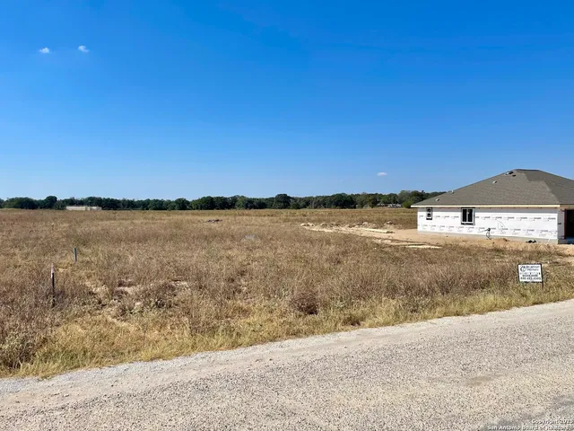 a view of a lake with a big yard