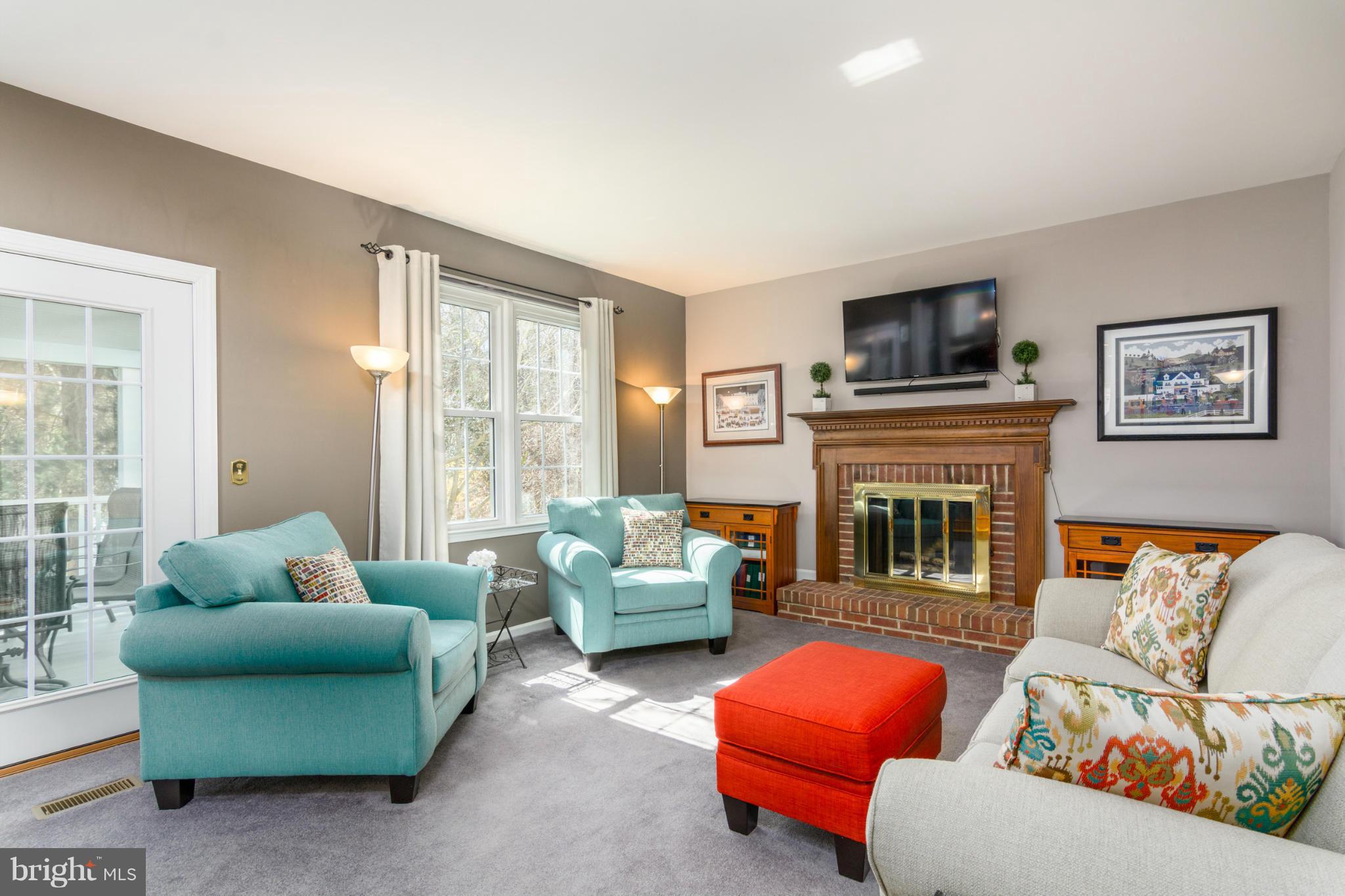3130 Stonehenge Drive Riva, MD 21140 - Photo 12 of 30 a living room with furniture a large window and a fireplace