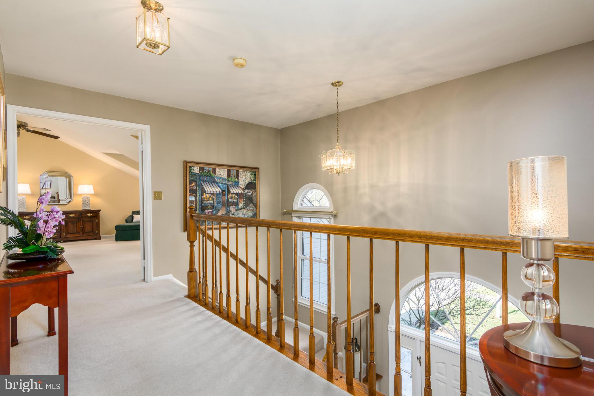 3130 Stonehenge Drive Riva, MD 21140 - Photo 21 of 30 a view of hallway with a large window and chandelier