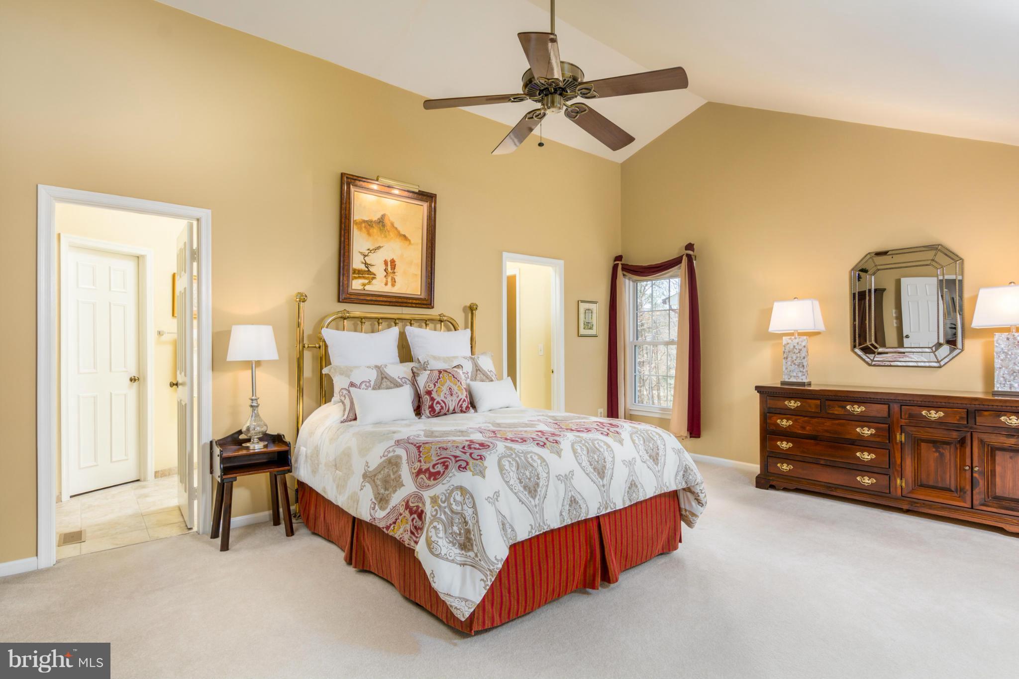 3130 Stonehenge Drive Riva, MD 21140 - Photo 22 of 30 a bedroom with a bed lamps and dresser