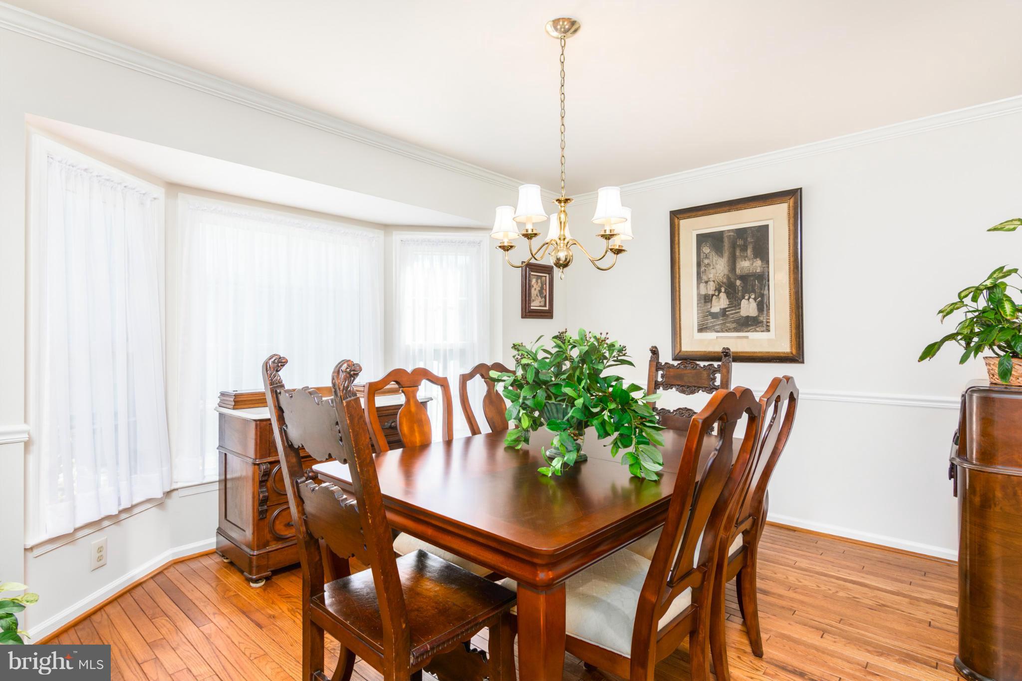 3130 Stonehenge Drive Riva, MD 21140 - Photo 7 of 30 a view of a dining room with furniture and chandelier