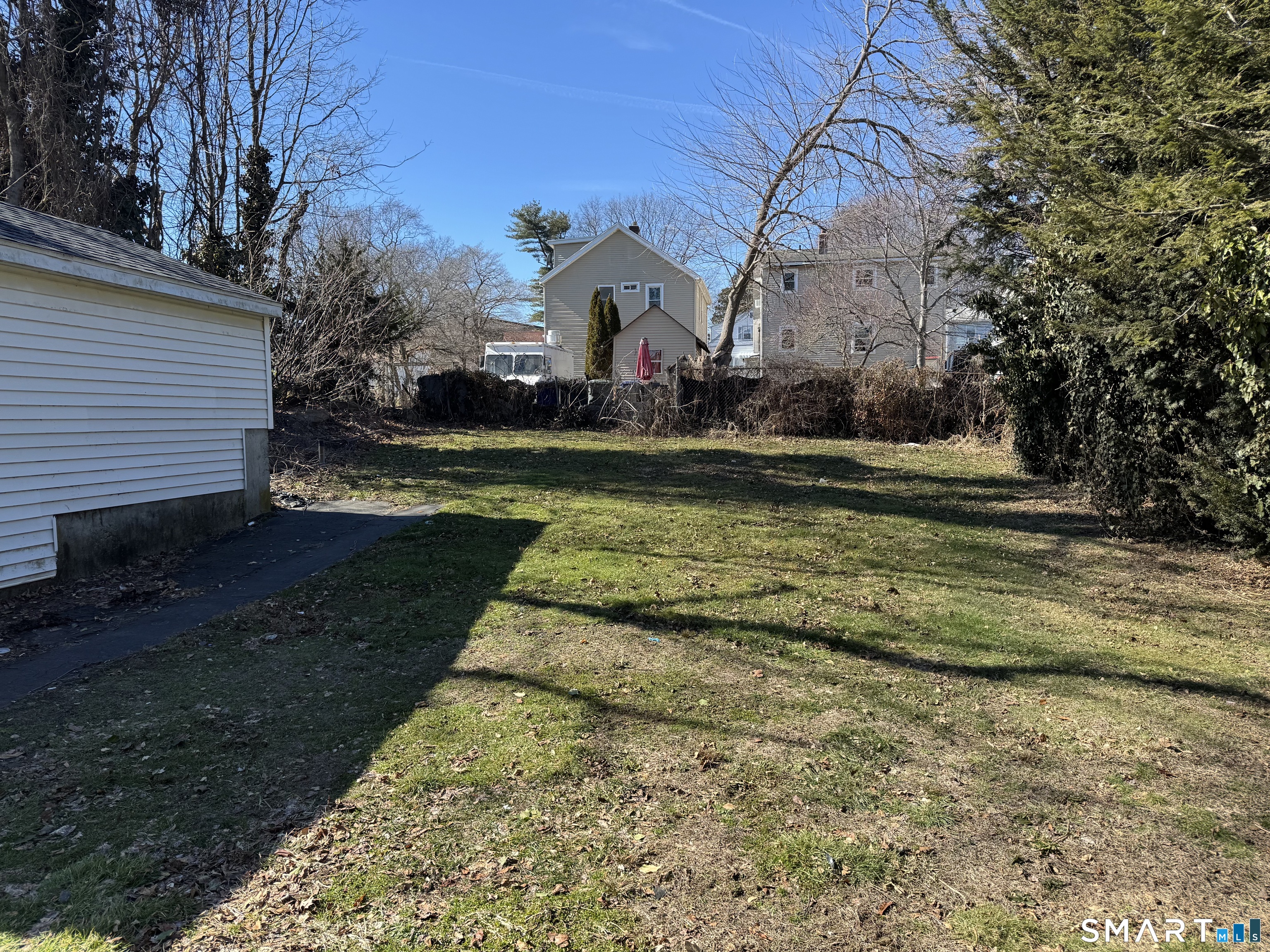 56 Sidney Street Bridgeport, CT 06606 - Photo 11 of 12 a swimming pool with wooden fence