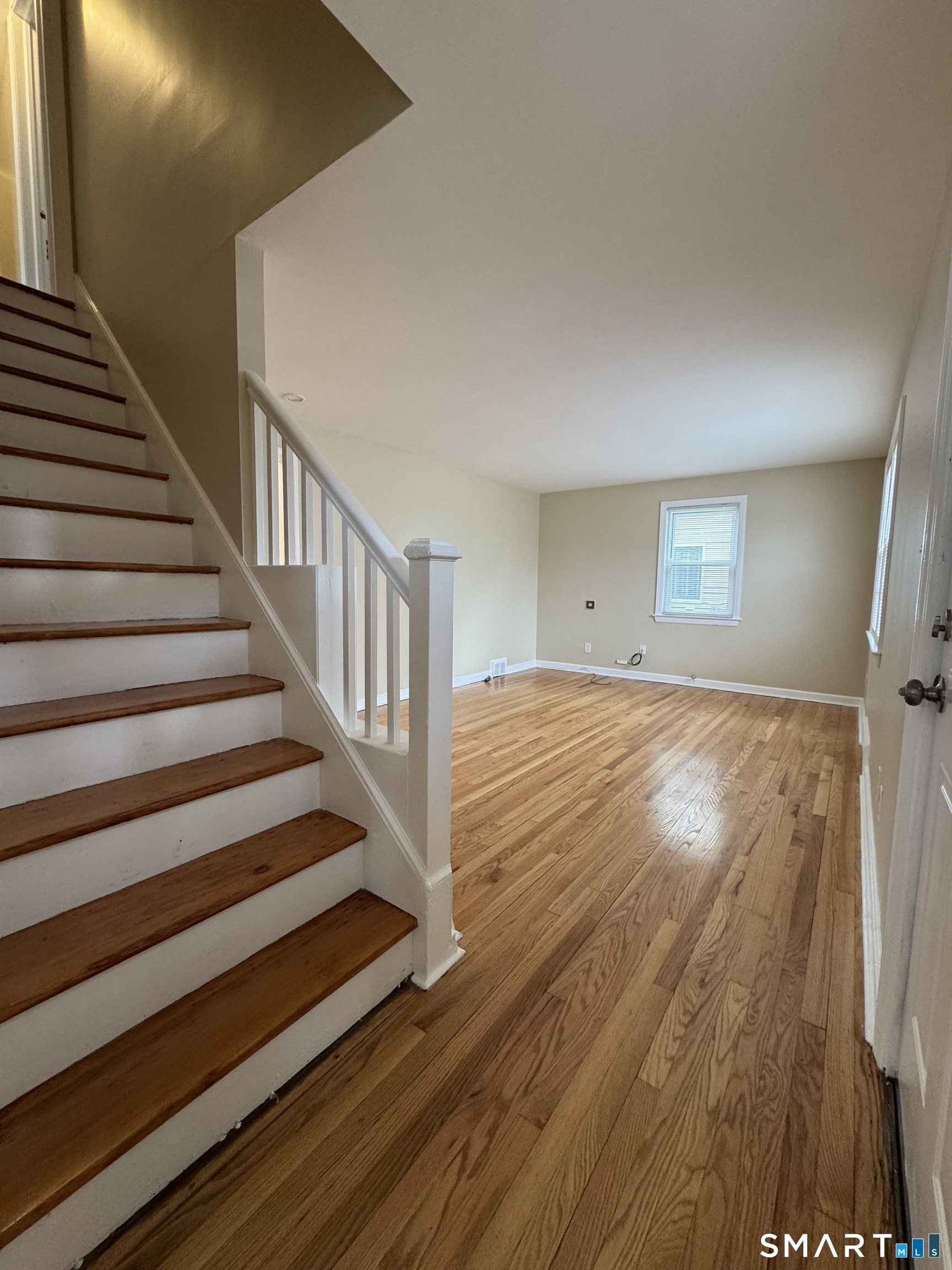 56 Sidney Street Bridgeport, CT 06606 - Photo 2 of 12 a view of entryway with wooden floor