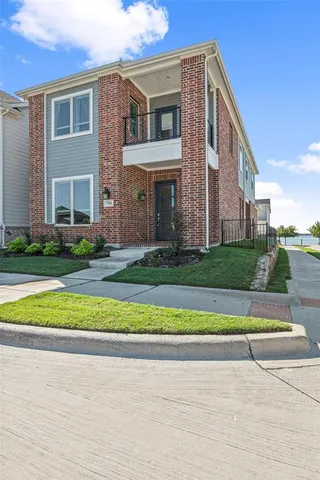 a view of a house with a swimming pool and a yard
