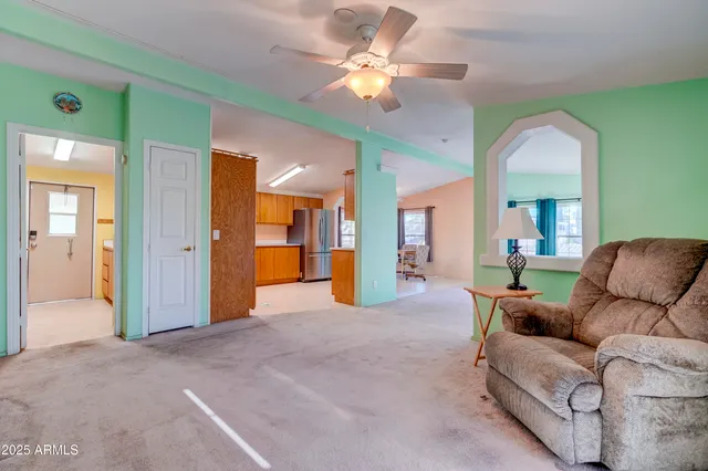 a living room with furniture and a window