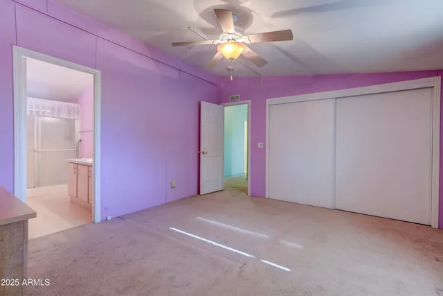 a view of a patio with table and chairs with wooden floor and fence