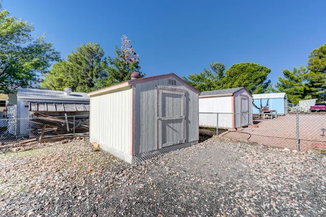 a view of a backyard with a garden and plants
