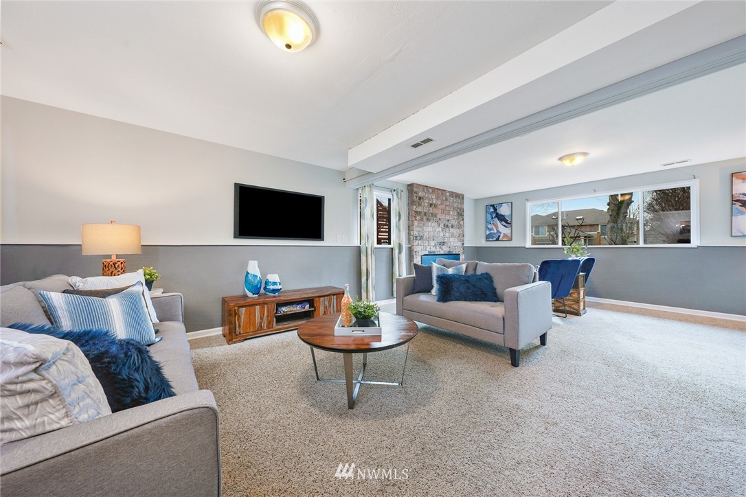 820 Southwest 3rd Place Renton, WA 98057 - Photo 11 of 18 a living room with furniture and a flat screen tv