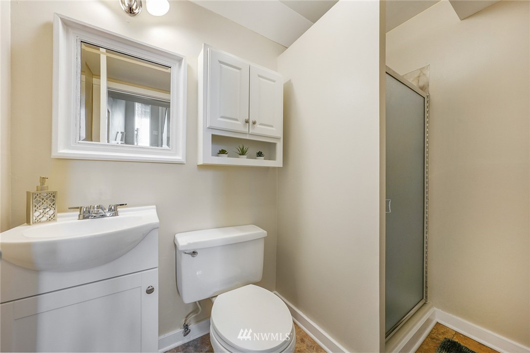 820 Southwest 3rd Place Renton, WA 98057 - Photo 13 of 18 a bathroom with a toilet sink and mirror