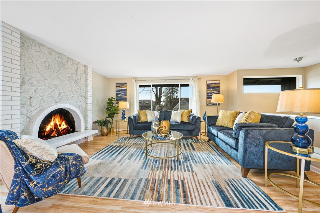 820 Southwest 3rd Place Renton, WA 98057 - Photo 2 of 18 a living room with furniture and a fireplace
