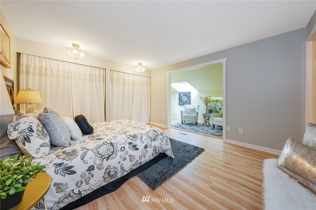 820 Southwest 3rd Place Renton, WA 98057 - Photo 5 of 18 a bedroom with a large bed and a window