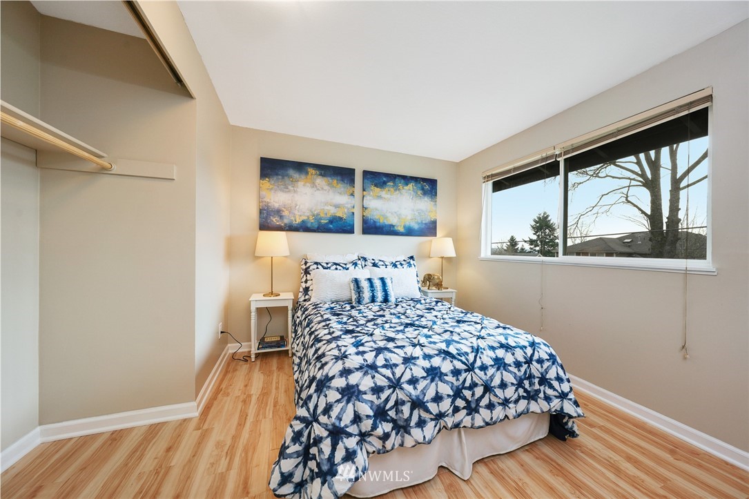 820 Southwest 3rd Place Renton, WA 98057 - Photo 8 of 18 a bedroom with a large bed and a window