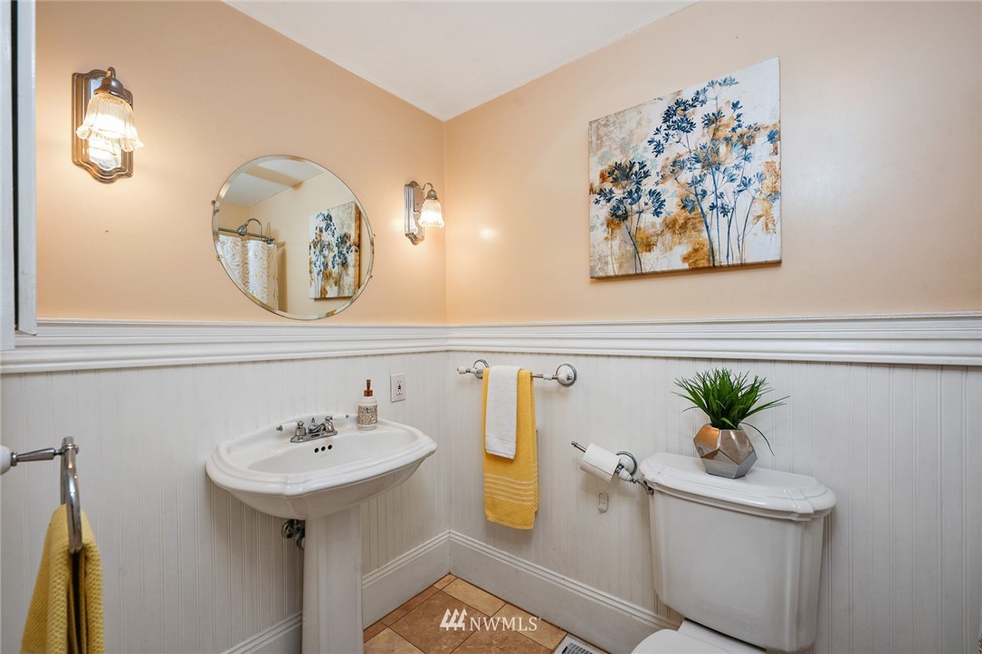 820 Southwest 3rd Place Renton, WA 98057 - Photo 9 of 18 a bathroom with a sink a mirror and a potted plant