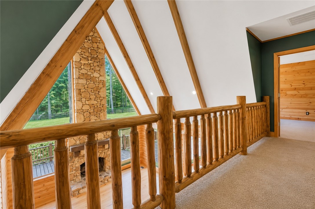 414 Devon Way Anderson, SC 29621 - Photo 25 of 50 A striking stone fireplace hearth anchors this grand living space with soaring vaulted ceilings.