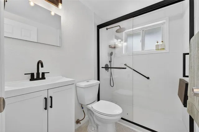 a view of a room with windows and chandelier