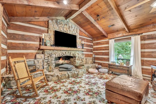 a view of a kitchen with a sink and cabinets