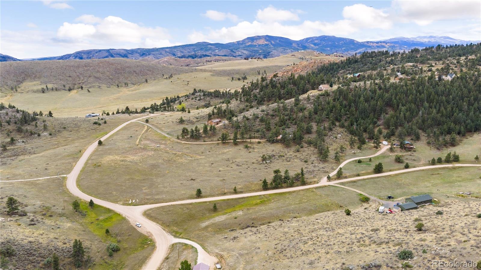 609 Eiger Road Livermore, CO 80536 - Photo 3 of 22 a view of a swimming pool with a mountain