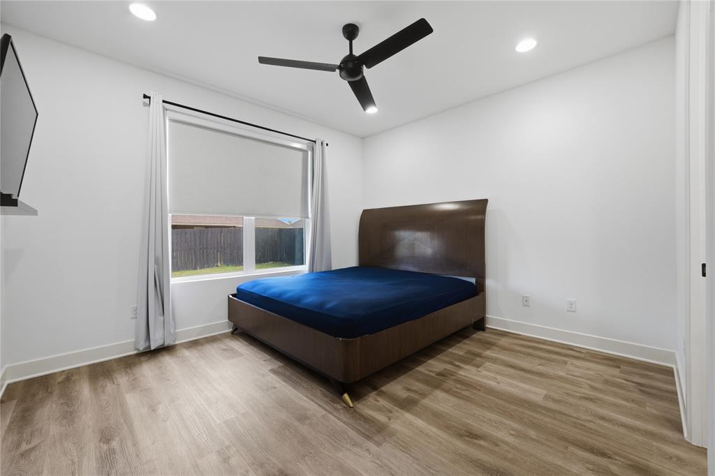 314 James Street Mabank, TX 75147 - Photo 13 of 25 a bedroom with a bed and a window