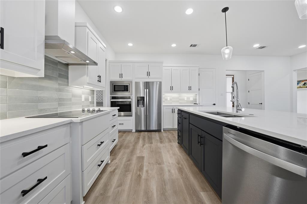 314 James Street Mabank, TX 75147 - Photo 15 of 25 a large kitchen with cabinets