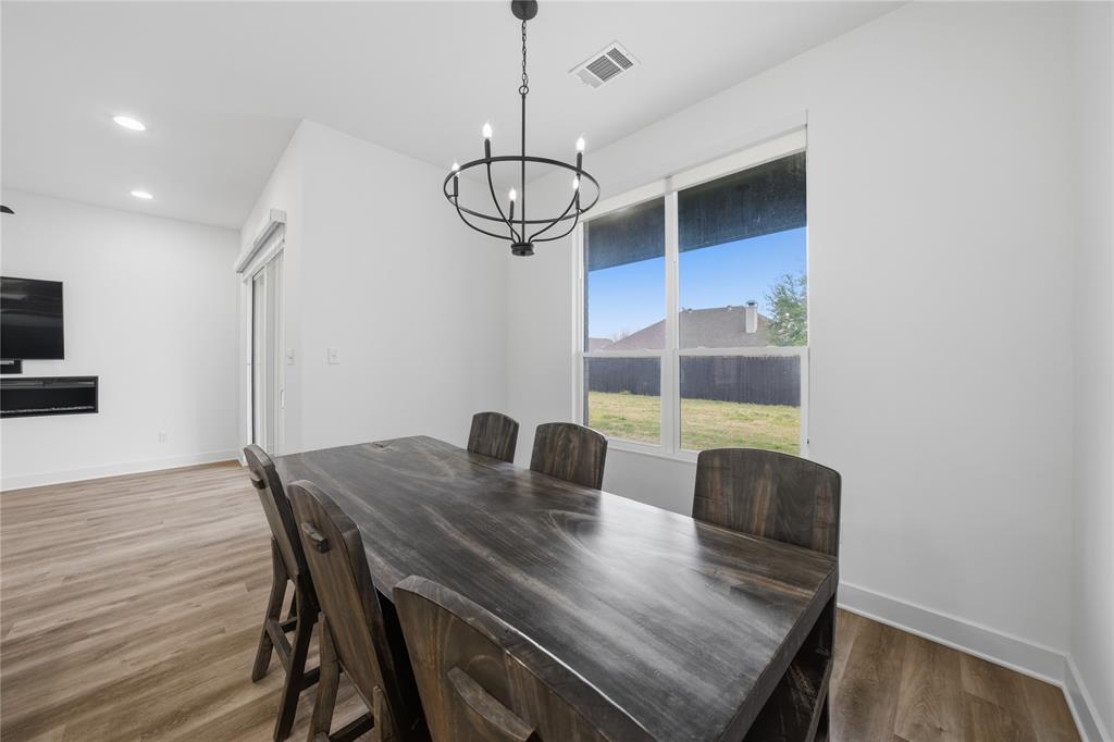 314 James Street Mabank, TX 75147 - Photo 18 of 25 a view of a dining room with furniture window and wooden floor