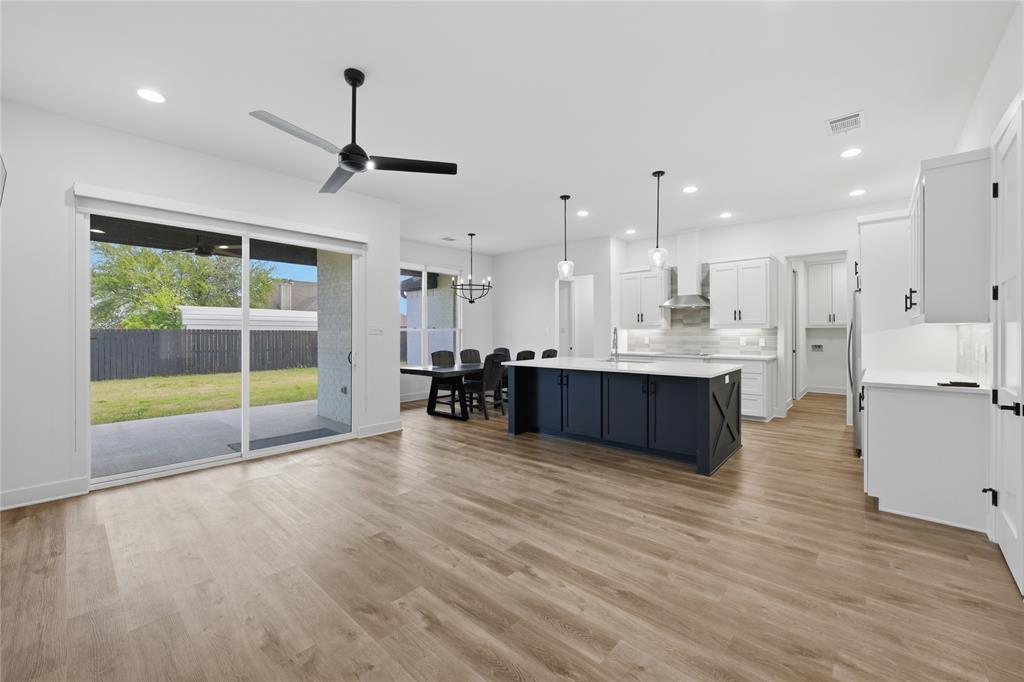 314 James Street Mabank, TX 75147 - Photo 20 of 25 a view of kitchen with wooden floor and windows