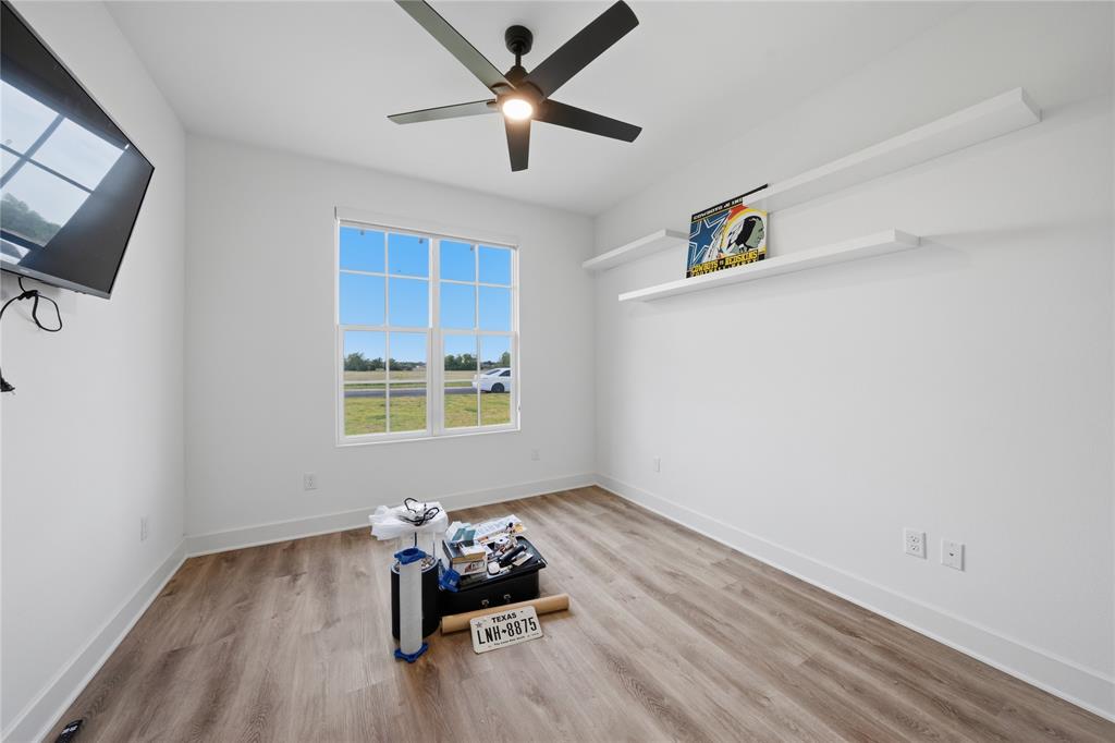 314 James Street Mabank, TX 75147 - Photo 22 of 25 a room with furniture and a window