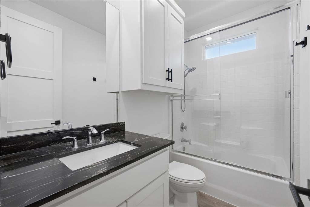 314 James Street Mabank, TX 75147 - Photo 23 of 25 a bathroom with a sink and a mirror