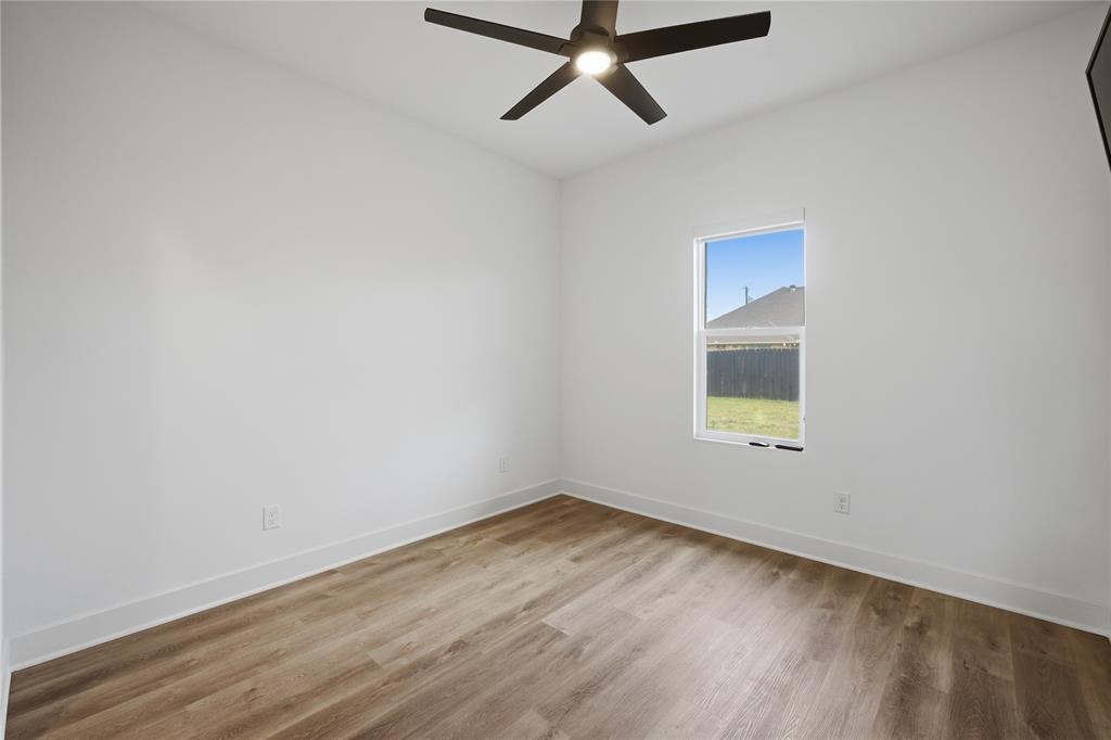 314 James Street Mabank, TX 75147 - Photo 24 of 25 an empty room with a window and ceiling fan