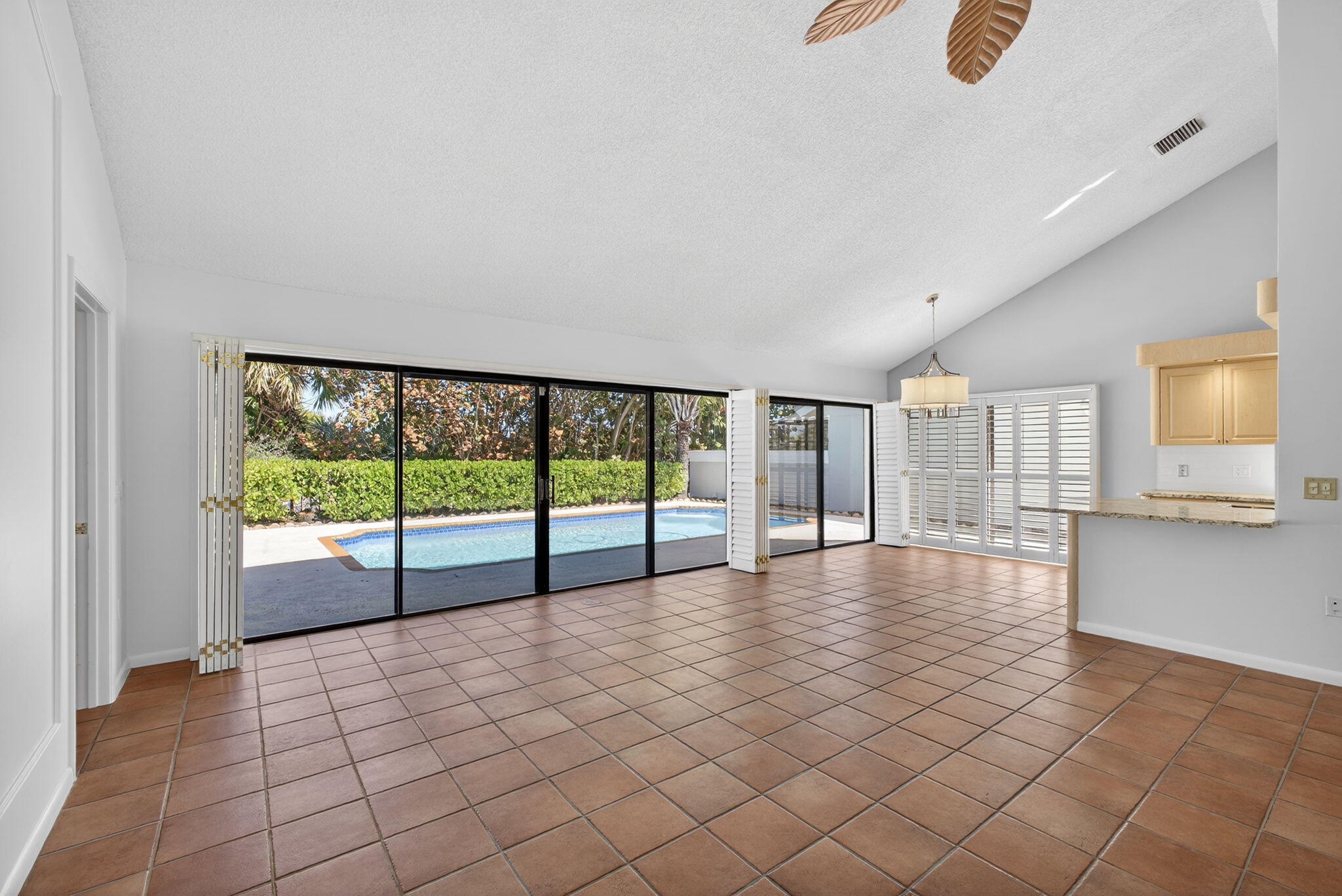 239 Ridge Road Jupiter, FL 33477 - Photo 14 of 75 a view of an empty room with a window