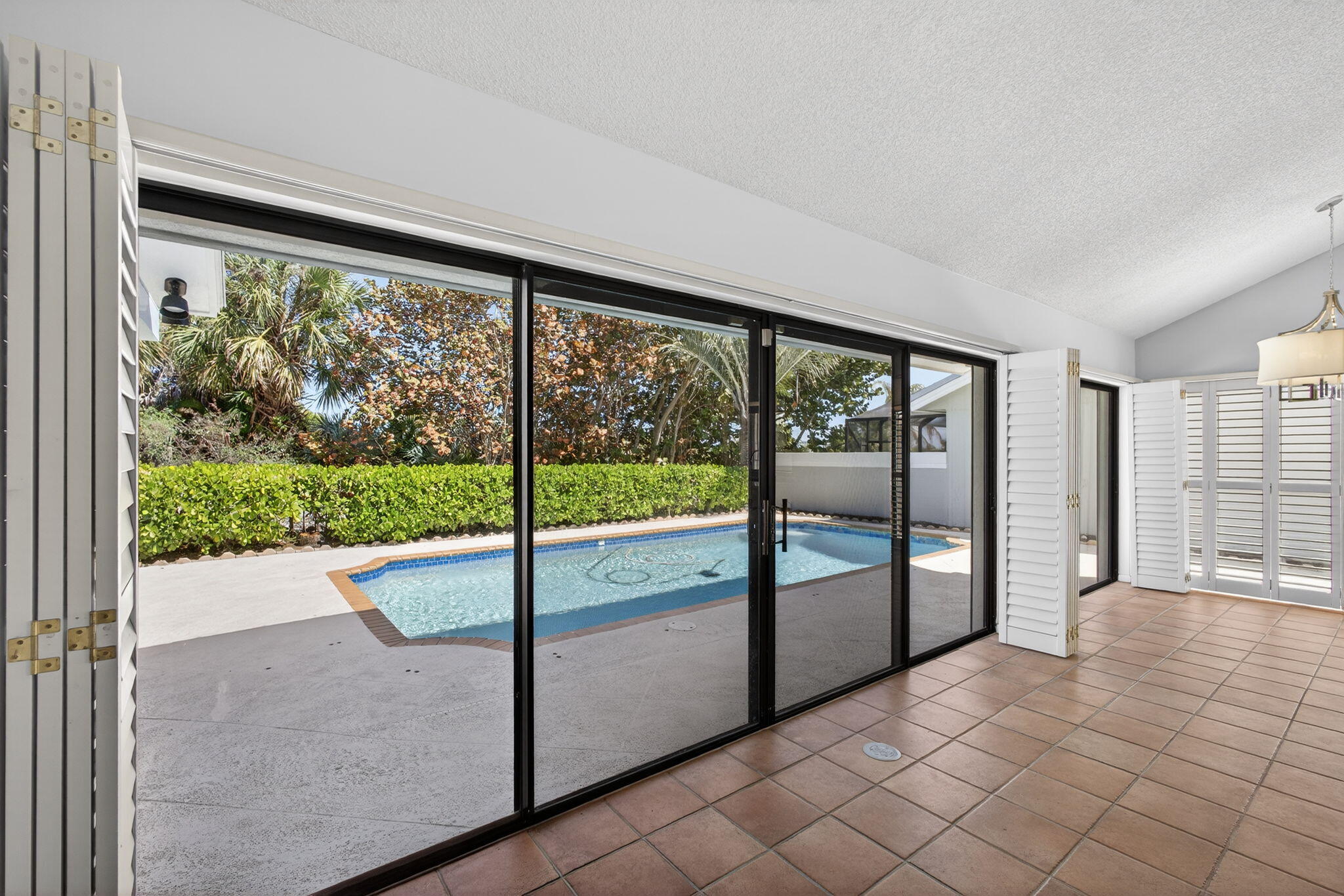 239 Ridge Road Jupiter, FL 33477 - Photo 18 of 75 a view of an empty room with a large window