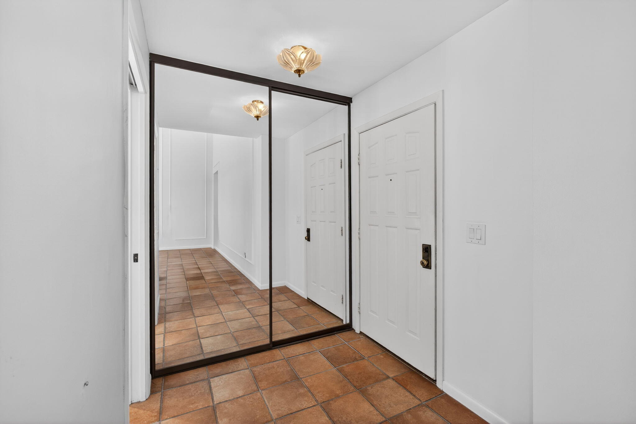 239 Ridge Road Jupiter, FL 33477 - Photo 30 of 75 a view of a hallway with wooden floor and entryway