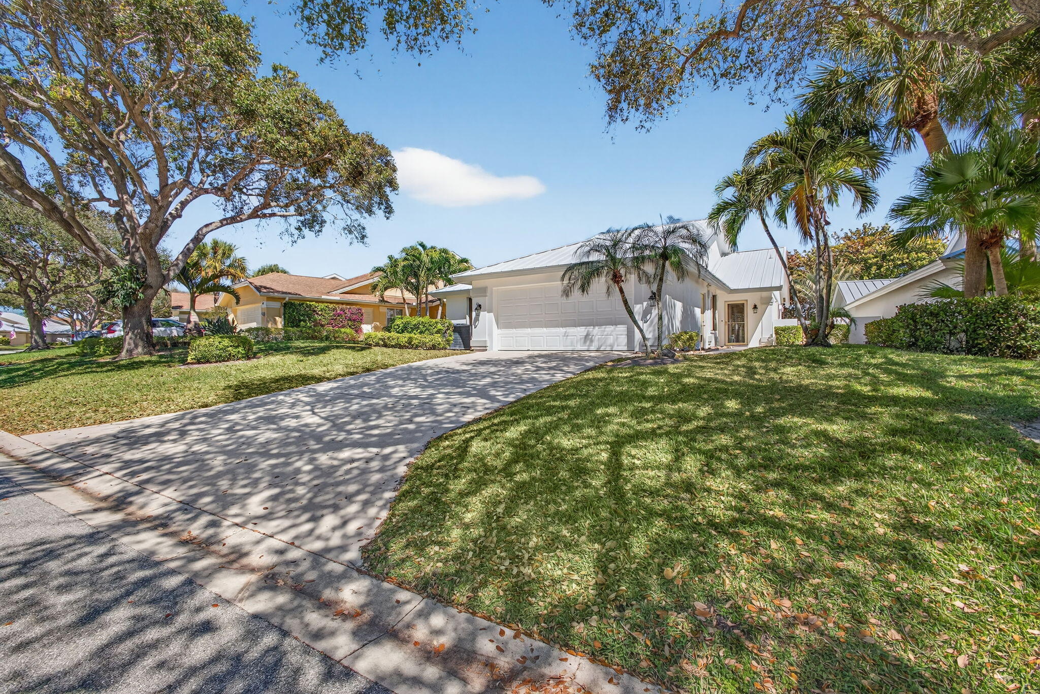 239 Ridge Road Jupiter, FL 33477 - Photo 3 of 75 a view of a street with a building in the background