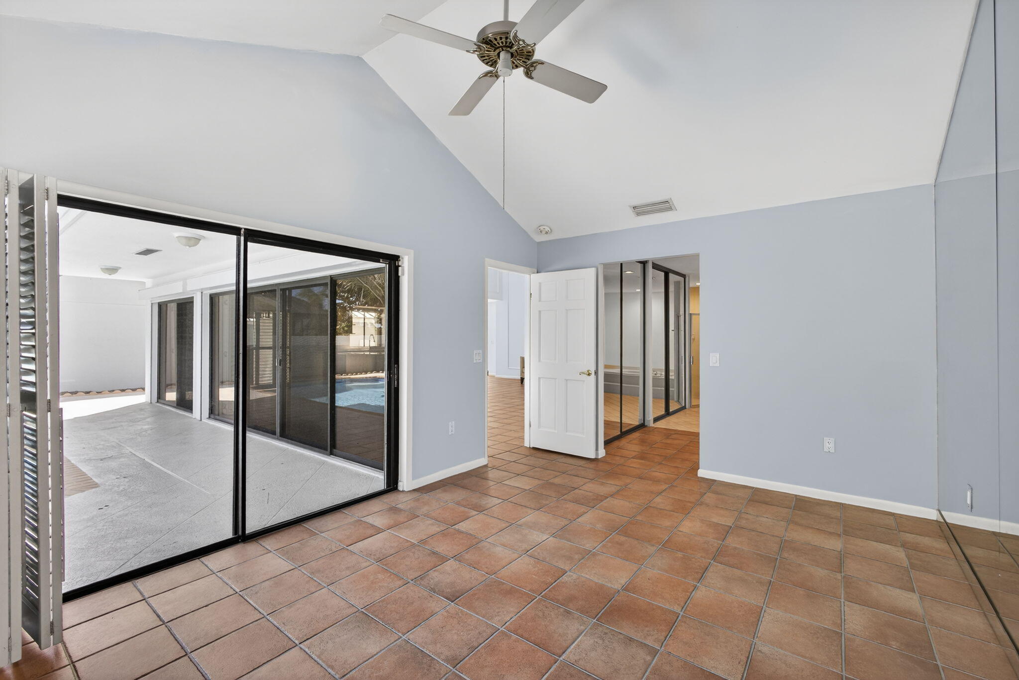 239 Ridge Road Jupiter, FL 33477 - Photo 33 of 75 a view of a hallway with a chandelier