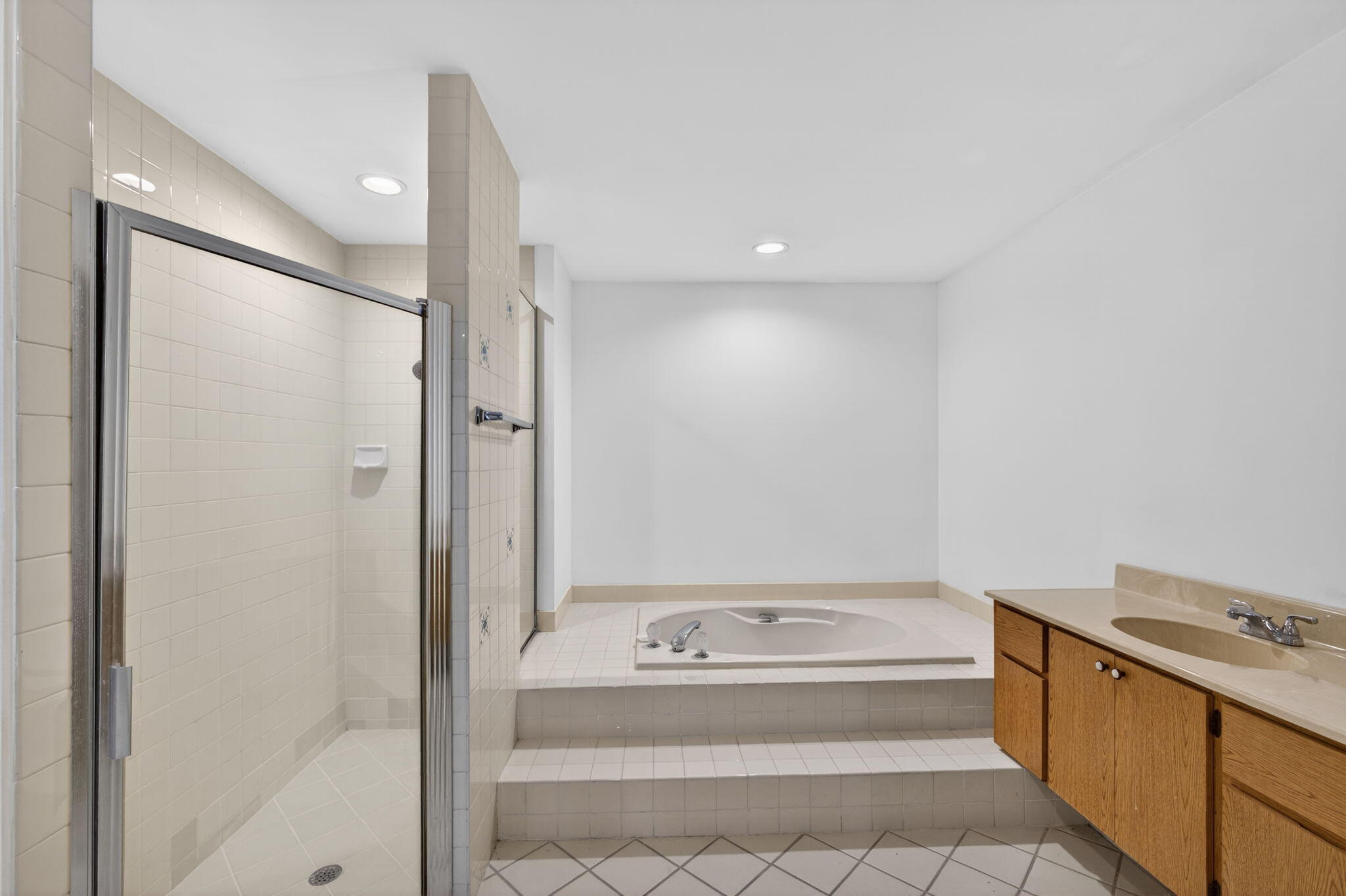 239 Ridge Road Jupiter, FL 33477 - Photo 35 of 75 a bathroom with a bathtub and a sink