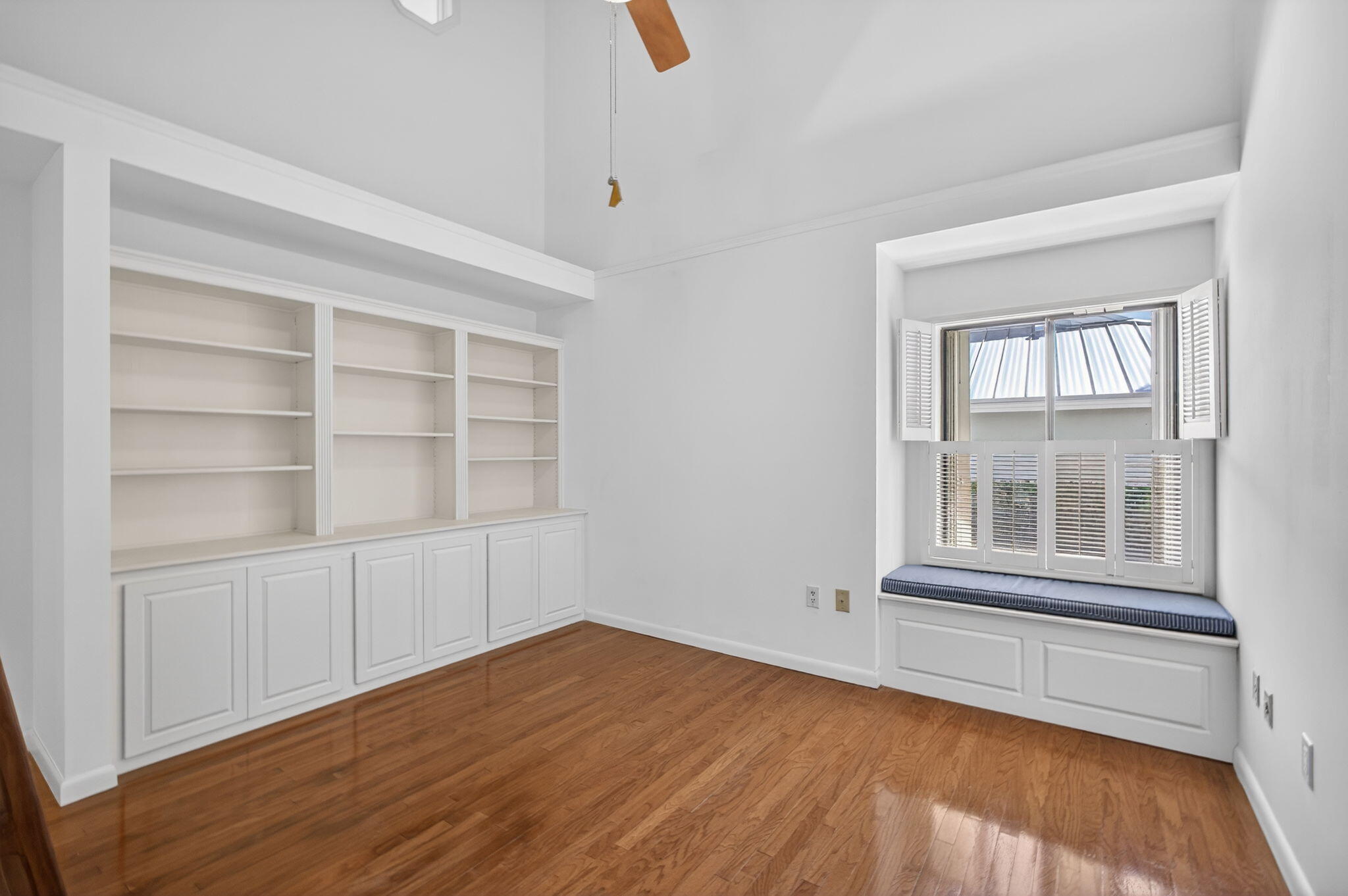239 Ridge Road Jupiter, FL 33477 - Photo 39 of 75 an empty room with wooden floor and windows