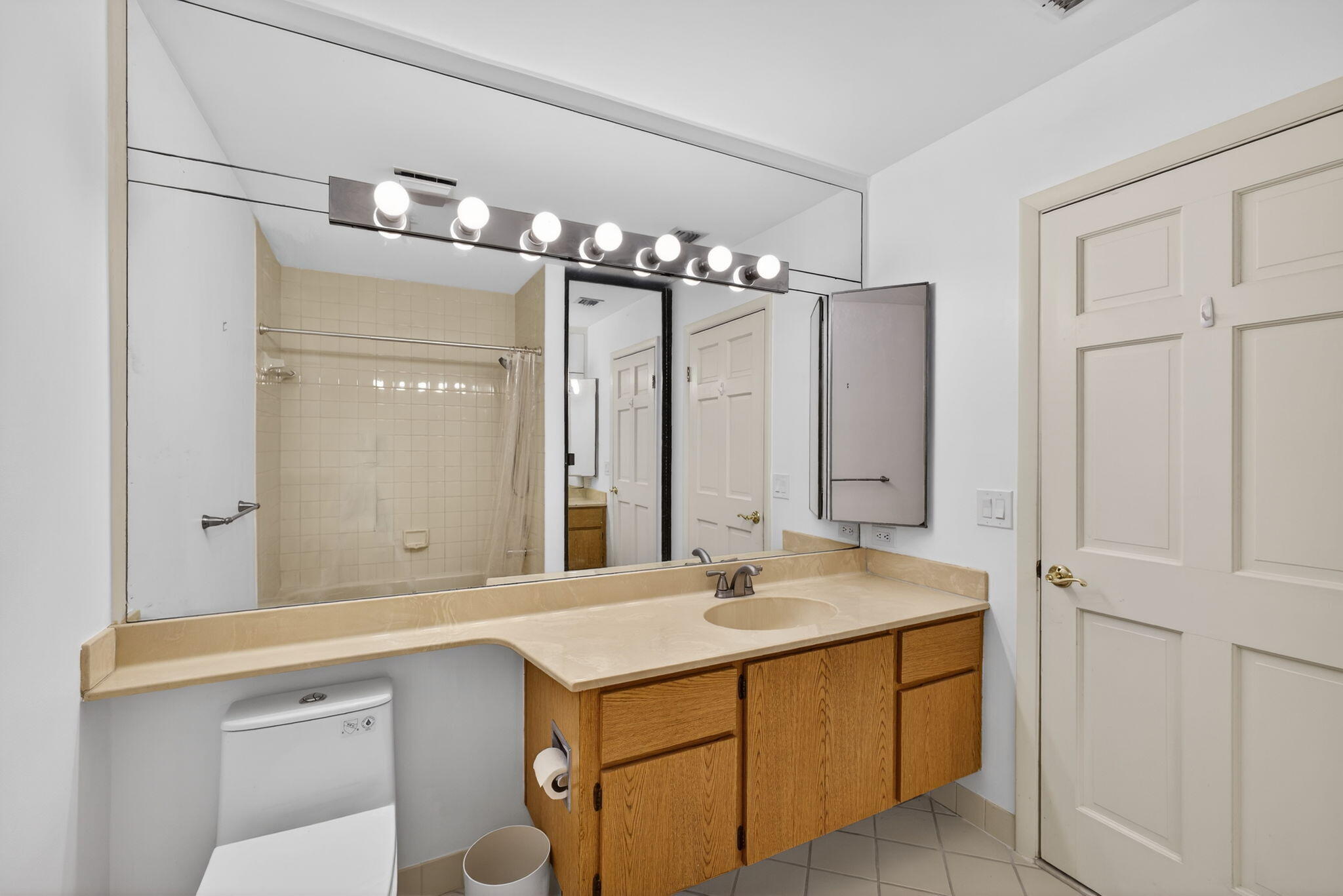 239 Ridge Road Jupiter, FL 33477 - Photo 46 of 75 a bathroom with a sink and a mirror