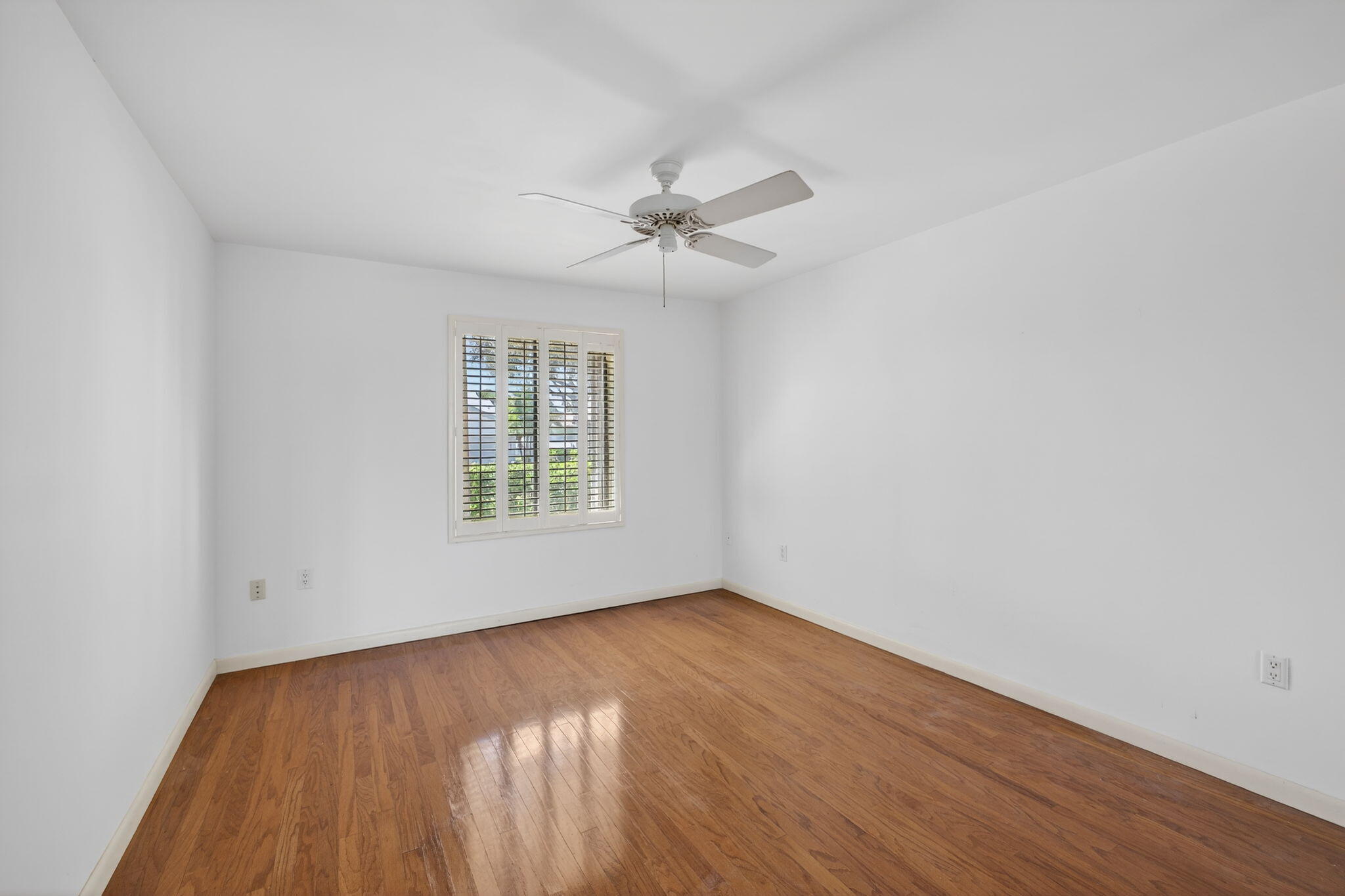 239 Ridge Road Jupiter, FL 33477 - Photo 48 of 75 wooden floor in an empty room with a window