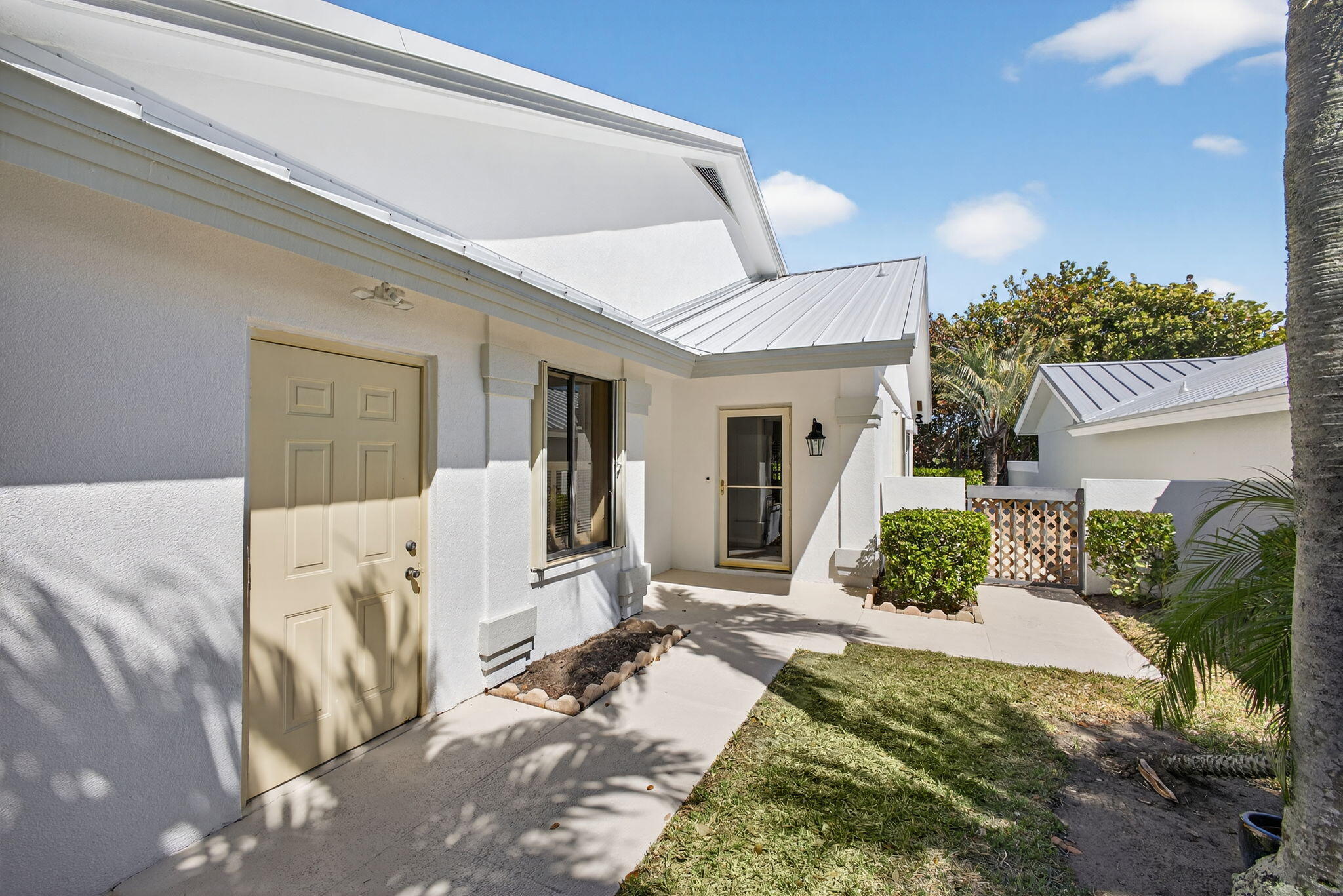 239 Ridge Road Jupiter, FL 33477 - Photo 6 of 75 a front view of a house with garden