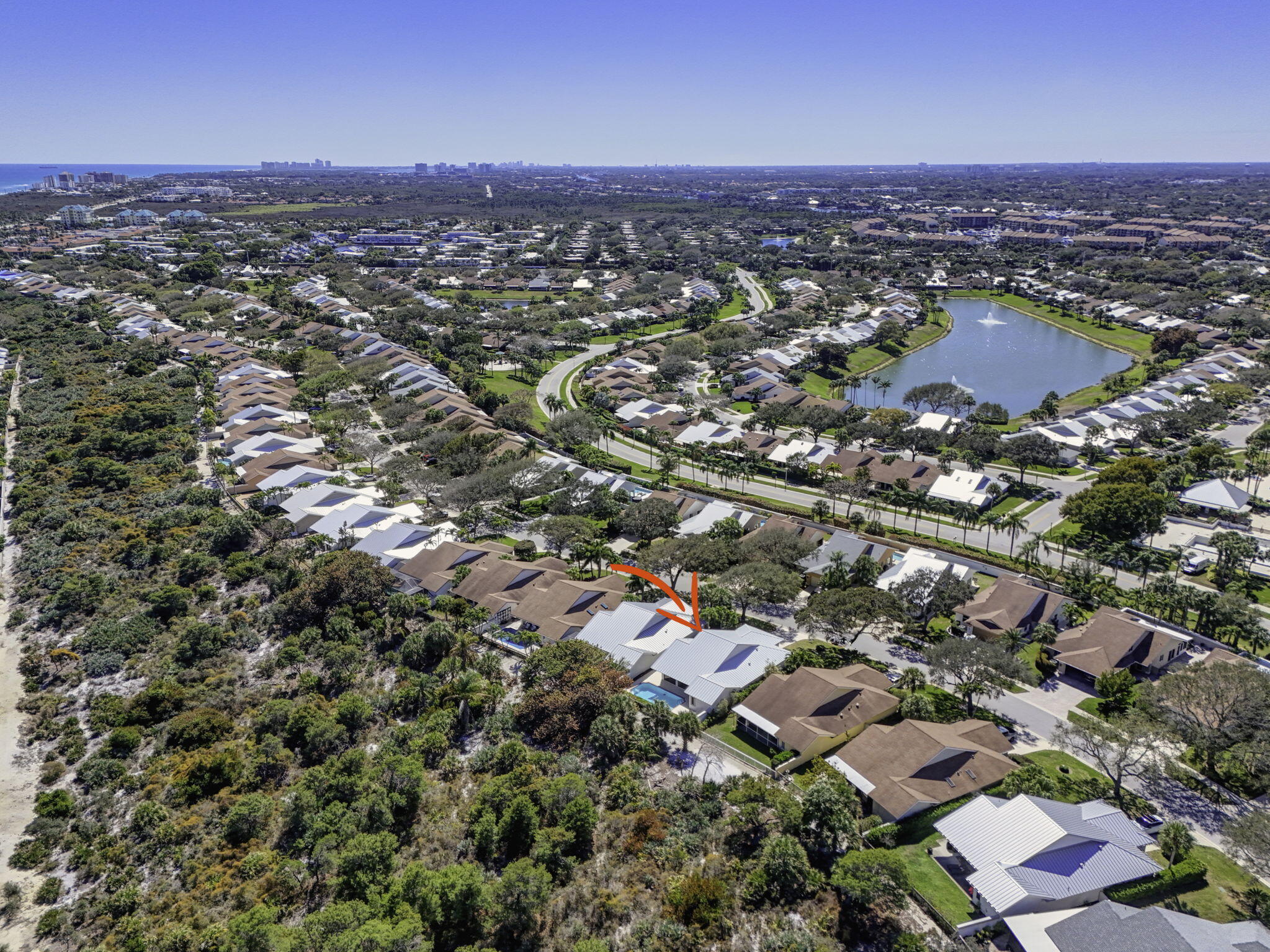 239 Ridge Road Jupiter, FL 33477 - Photo 68 of 75 an aerial view of a city with lots of residential buildings