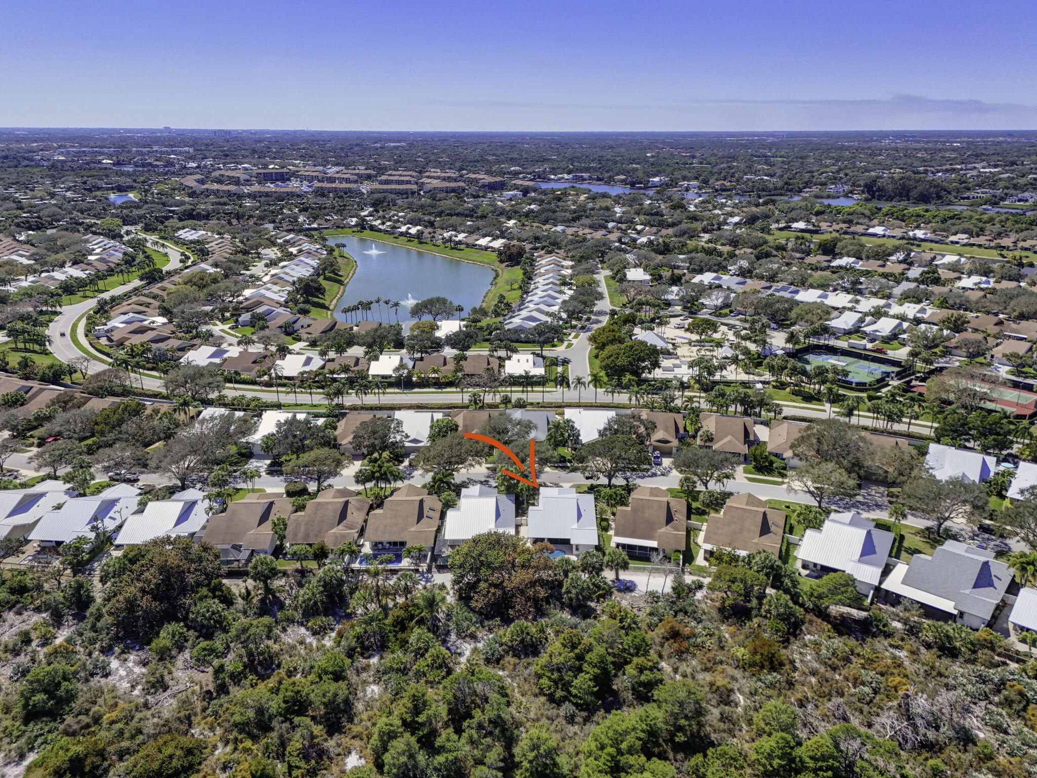 239 Ridge Road Jupiter, FL 33477 - Photo 69 of 75 an aerial view of a city with lots of residential buildings