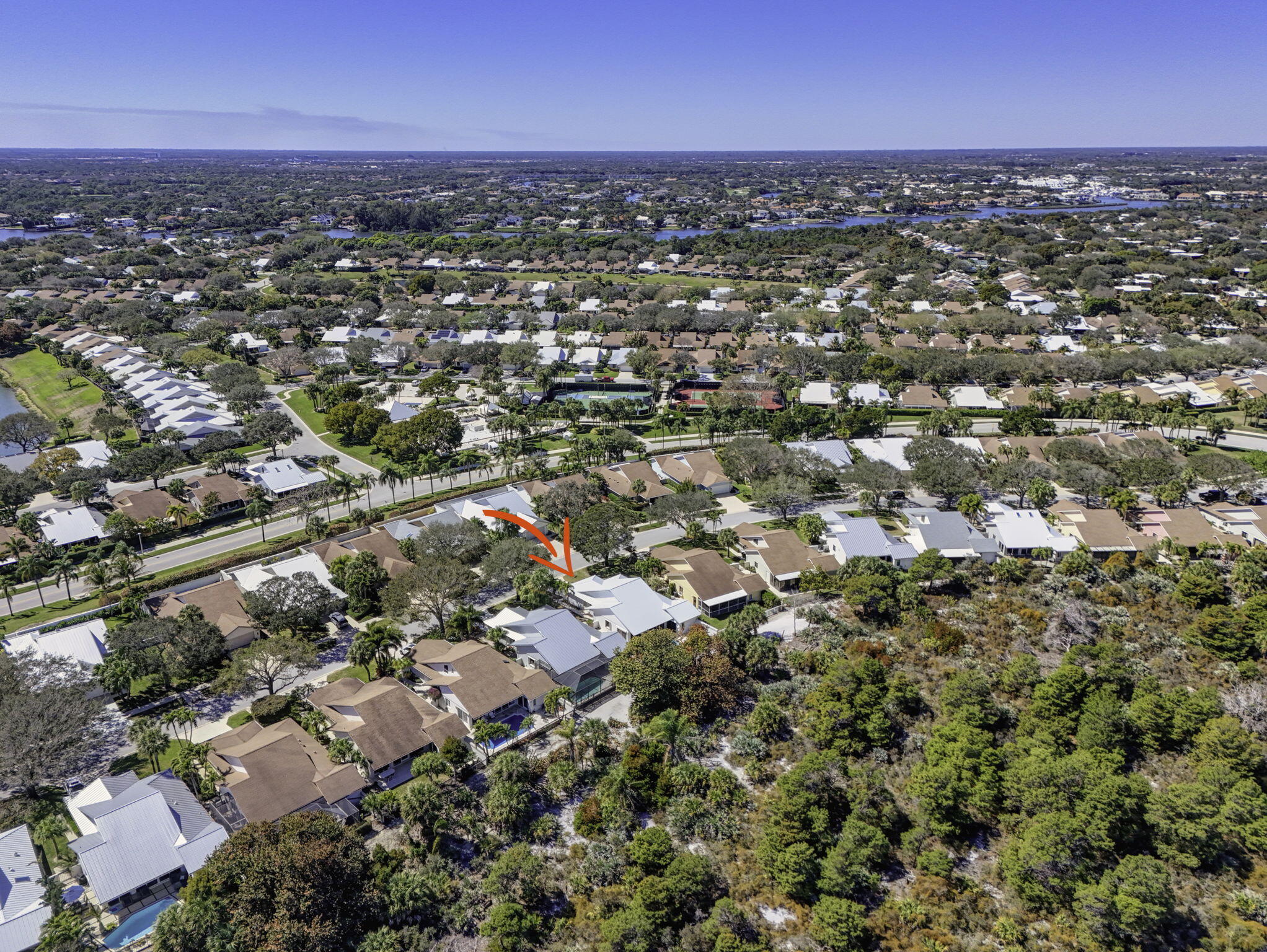 239 Ridge Road Jupiter, FL 33477 - Photo 70 of 75 an aerial view of a city with lots of residential buildings