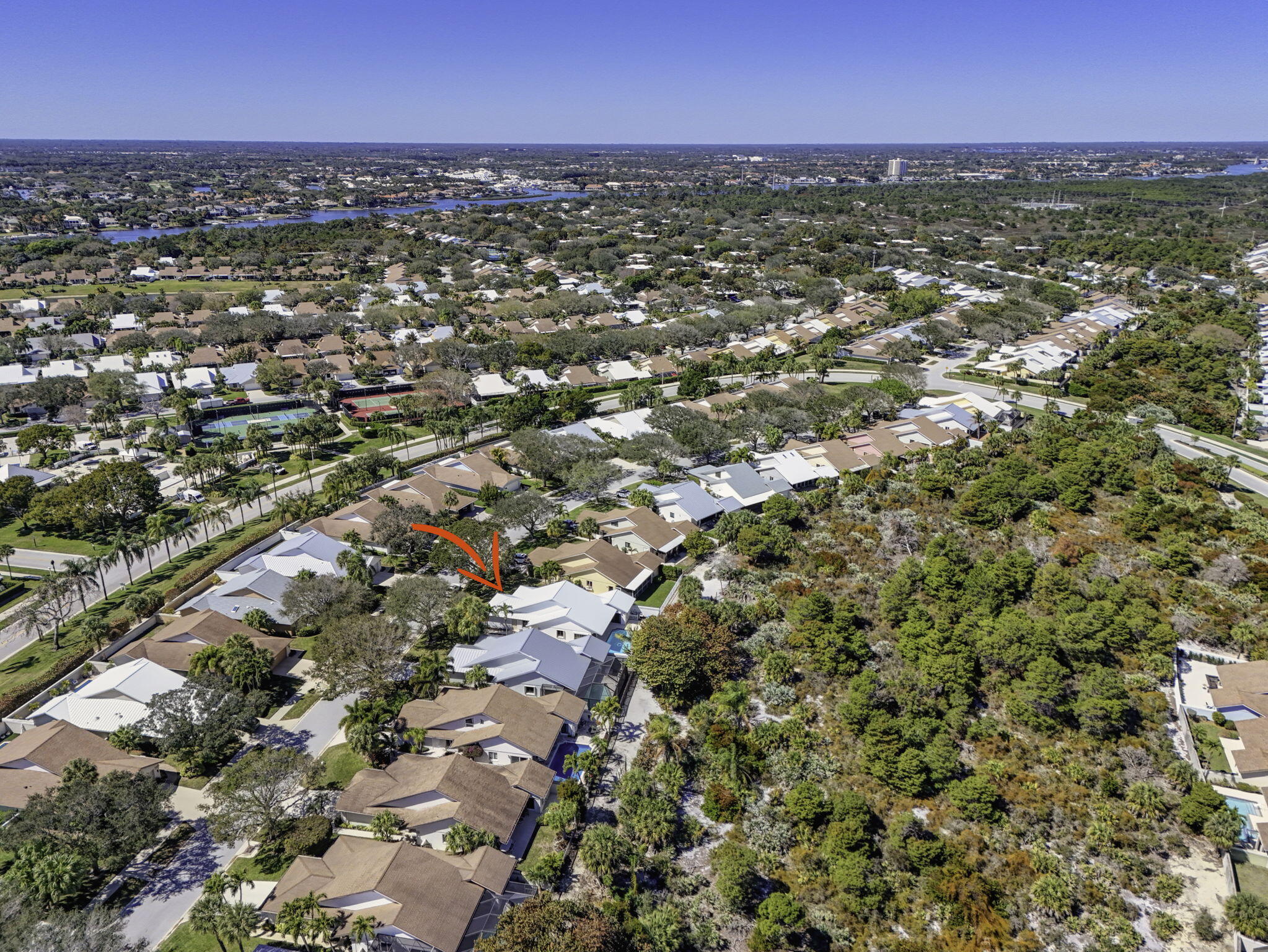239 Ridge Road Jupiter, FL 33477 - Photo 71 of 75 an aerial view of residential houses with outdoor space and trees