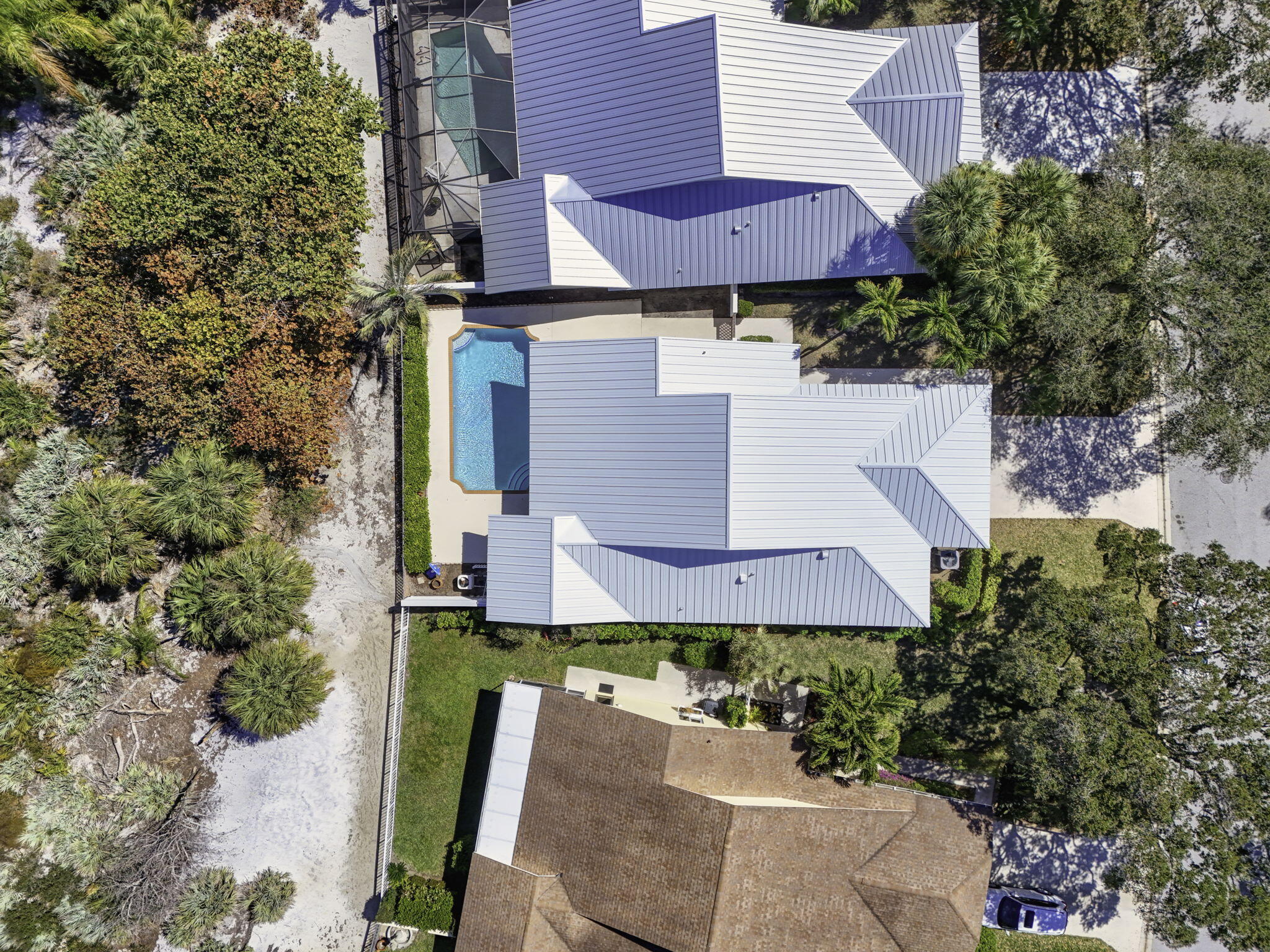 239 Ridge Road Jupiter, FL 33477 - Photo 75 of 75 an aerial view of a house with a yard and balcony