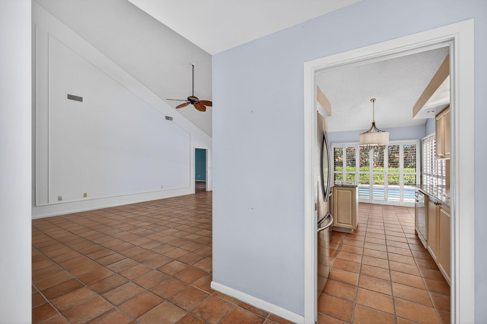 239 Ridge Road Jupiter, FL 33477 - Photo 9 of 75 a view of a room with a furniture and floor to ceiling window