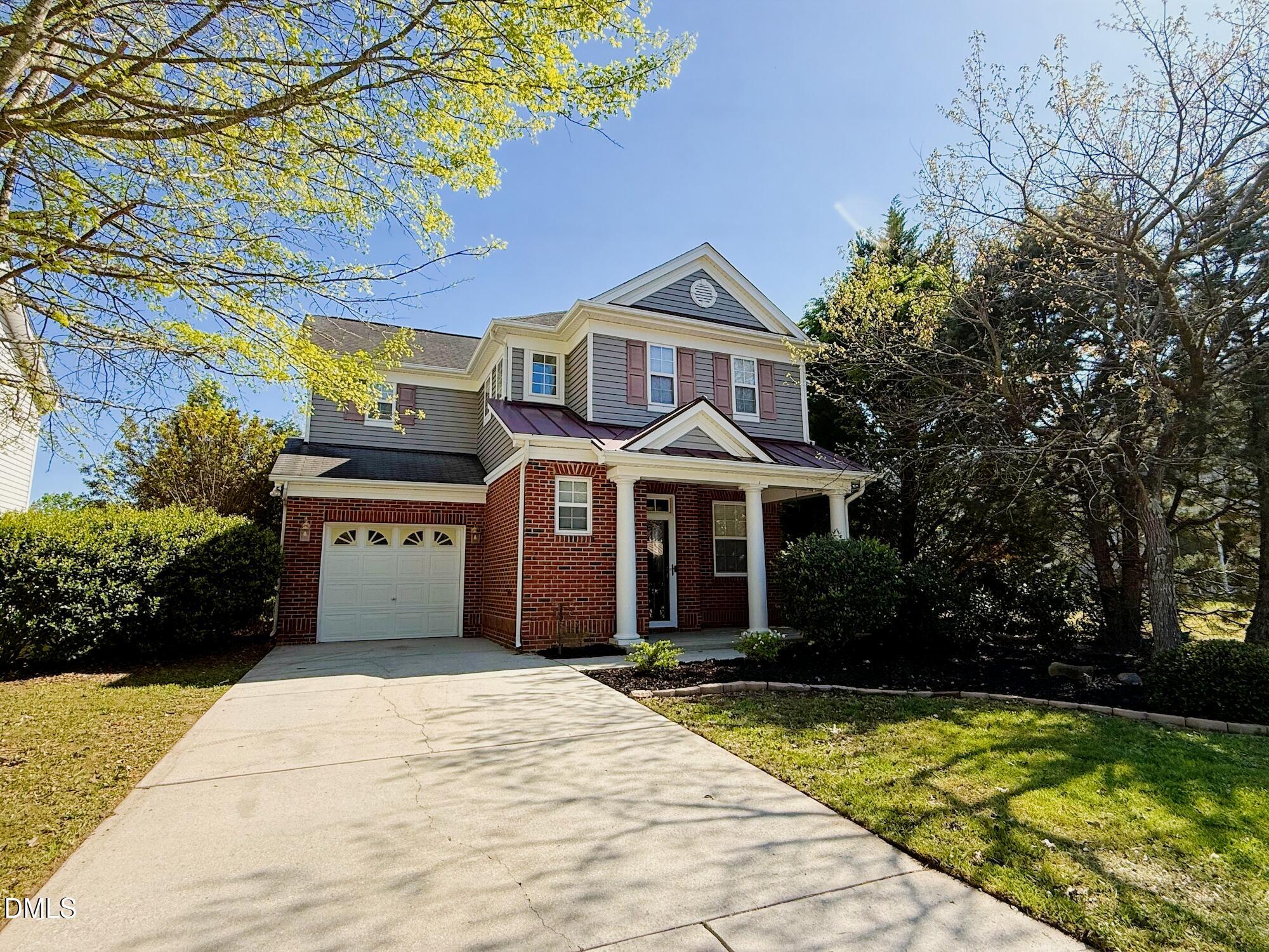 1104 Pebblestone Drive Durham, NC 27703 - Photo 1 of 28 a front view of a house with a yard