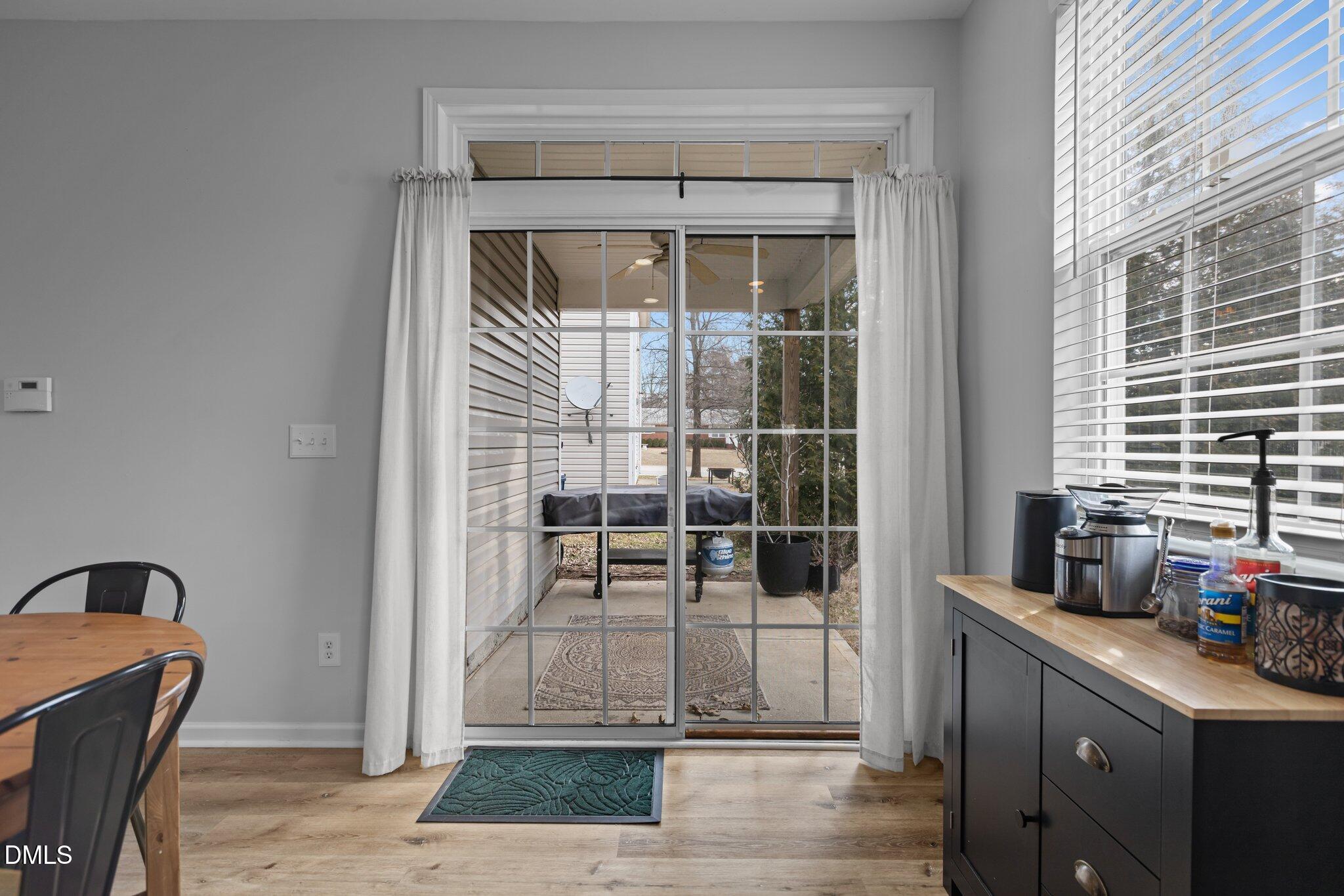 1104 Pebblestone Drive Durham, NC 27703 - Photo 13 of 28 a kitchen with granite countertop a coffee maker a sink and a window