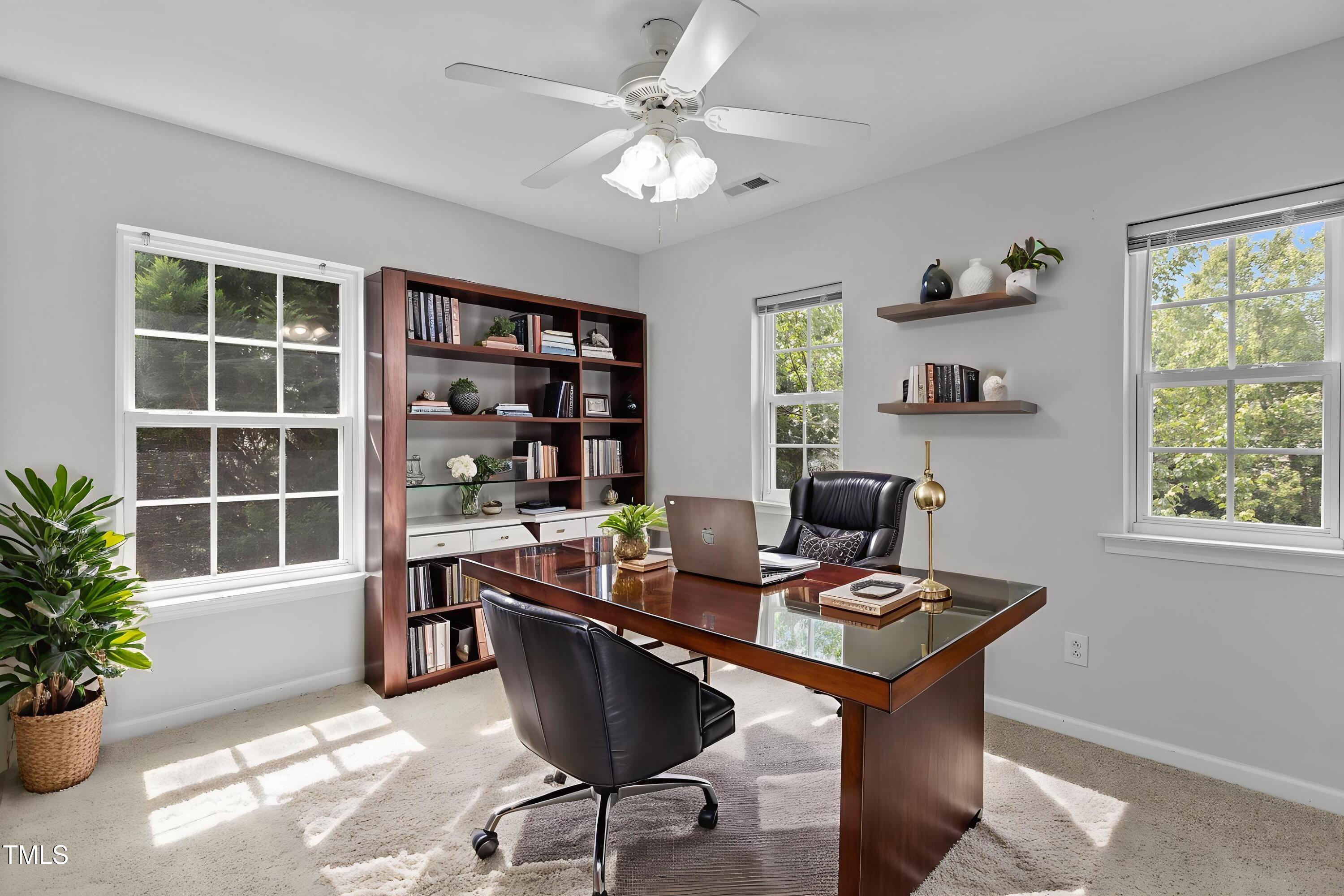 1104 Pebblestone Drive Durham, NC 27703 - Photo 20 of 28 a view of a workspace with furniture and a window